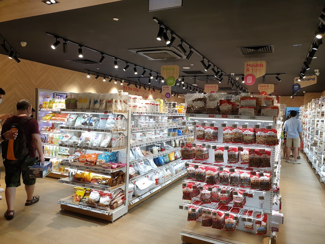 An interior view of RedMan by Phoon Huat, showcasing aisles filled with baking ingredients and supplies.