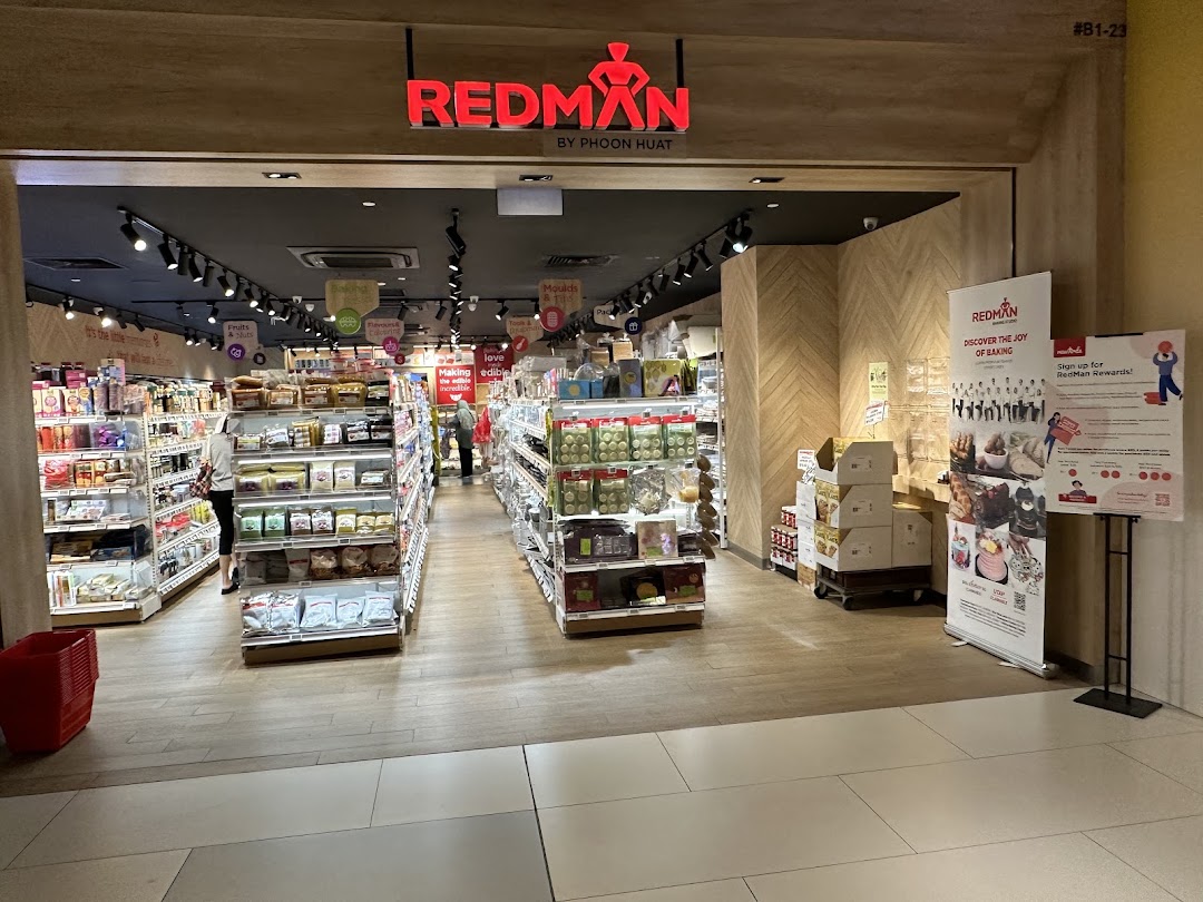 The entrance of RedMan by Phoon Huat, a baking supplies store, with aisles of products visible inside.