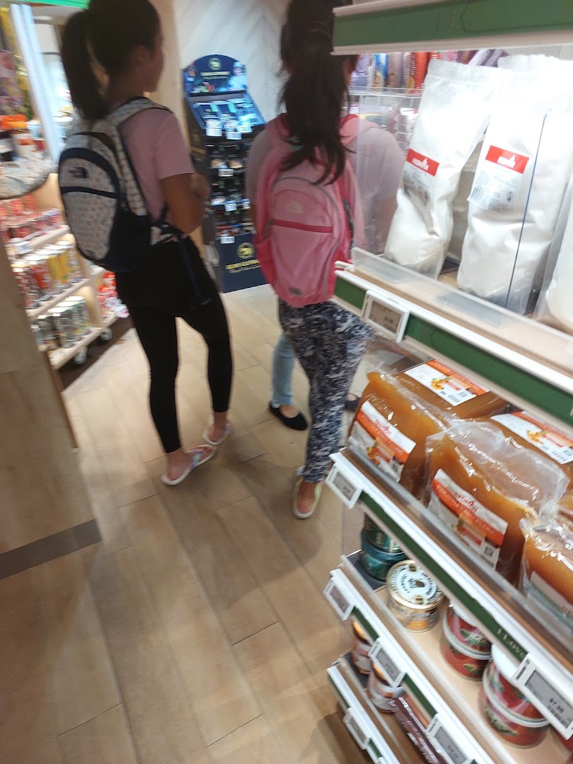 Customers browse shelves stocked with baking ingredients and packaged goods inside RedMan by Phoon Huat.