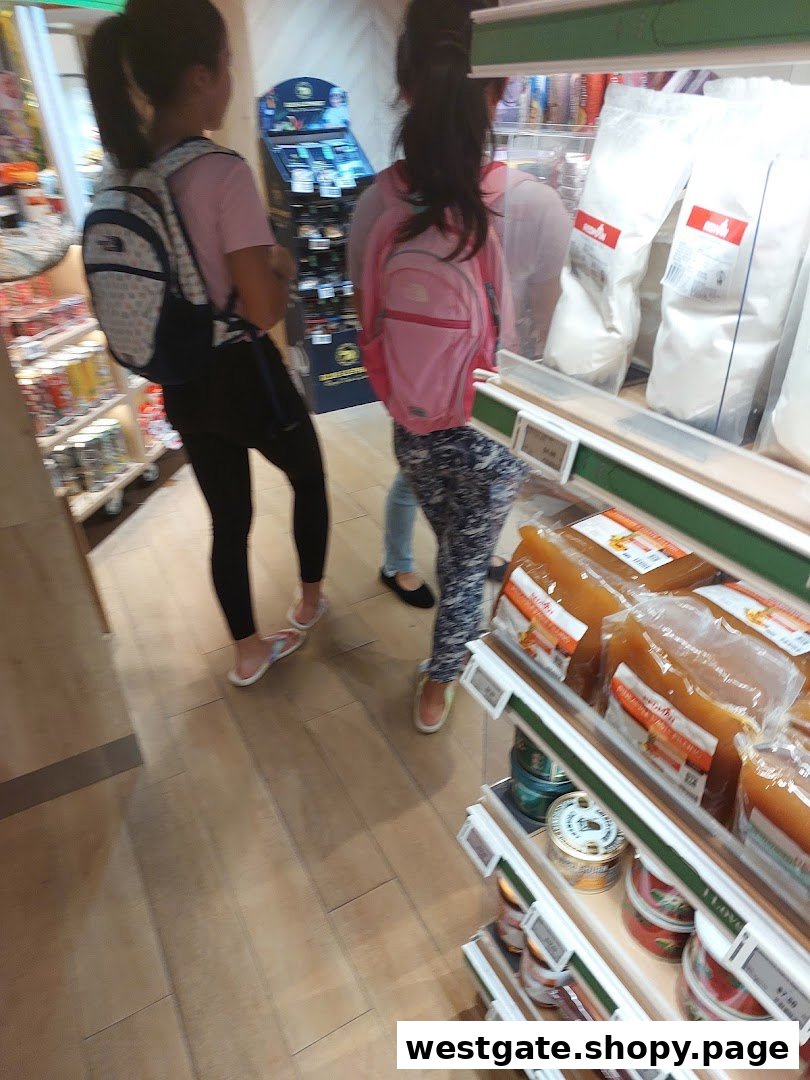 Customers browse shelves stocked with baking ingredients and packaged goods inside RedMan by Phoon Huat.
