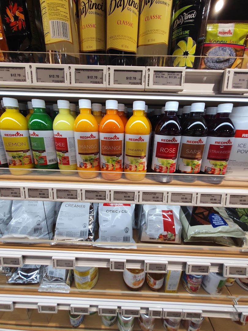 Shelves stocked with RedMan brand beverage concentrates, syrups, and baking ingredients.