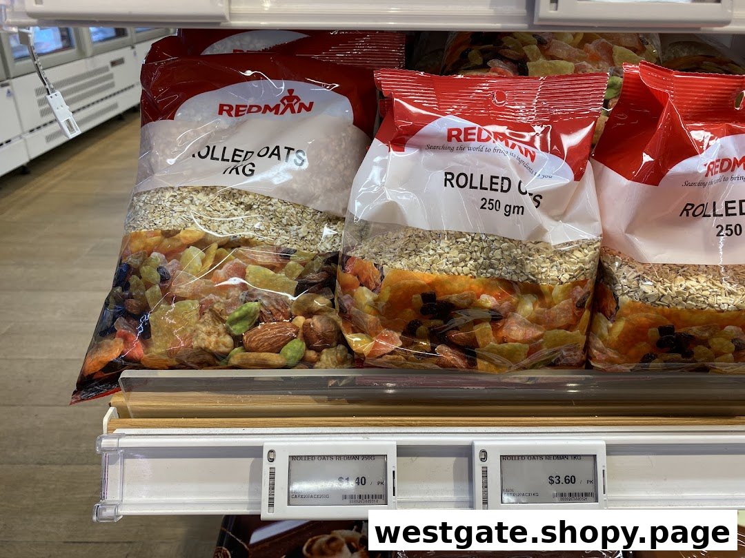 Bags of RedMan rolled oats and dried fruit mixes displayed on a retail shelf.