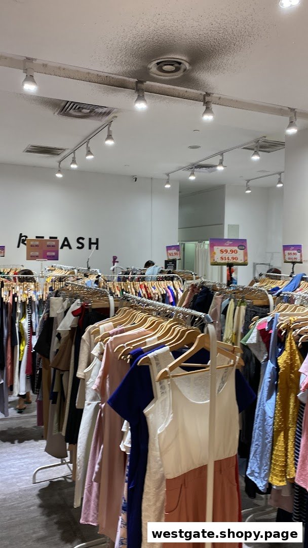 Interior view of REFASH Westgate, showcasing racks of preloved clothing for sale.