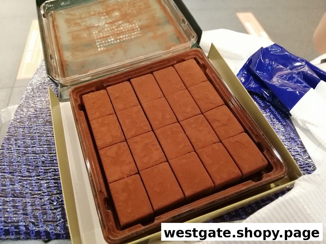 An open box of Royce's signature Nama Chocolate, featuring perfectly cut, cocoa-dusted squares.