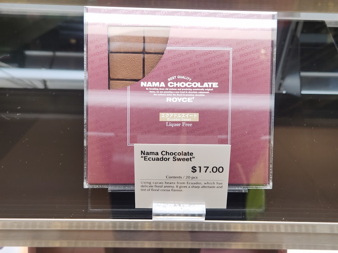 Close-up of Royce' Nama Chocolate 'Ecuador Sweet' product display with price and details.