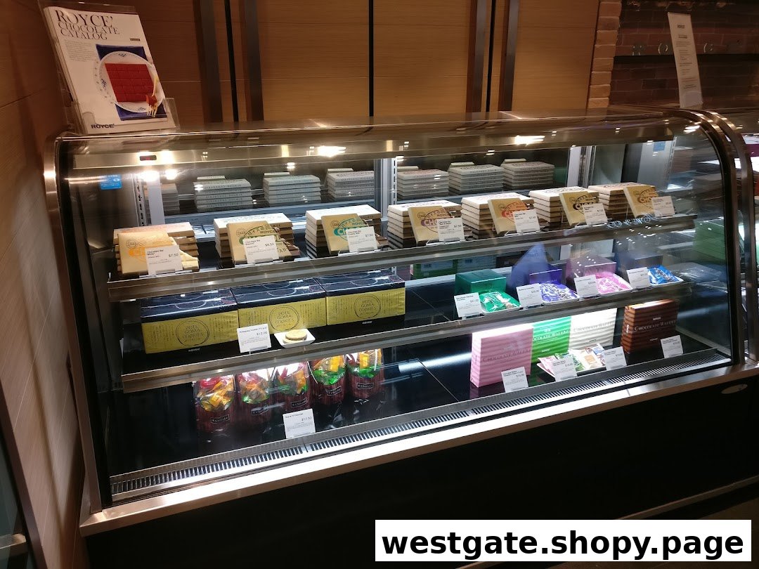 A well-lit display case showcasing a variety of Royce chocolates and confections.