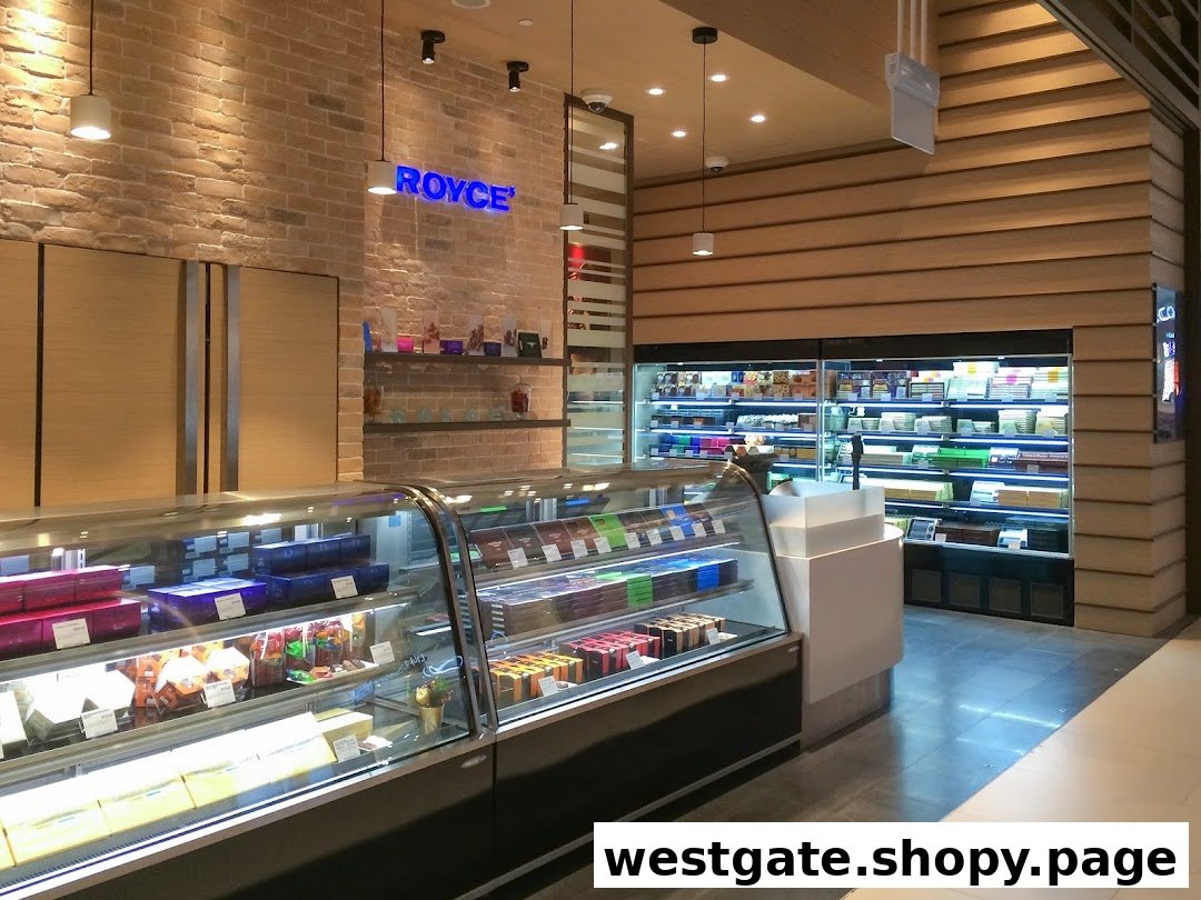 Interior view of Royce chocolate shop, showcasing display cases filled with various confections and a prominent brand sign.