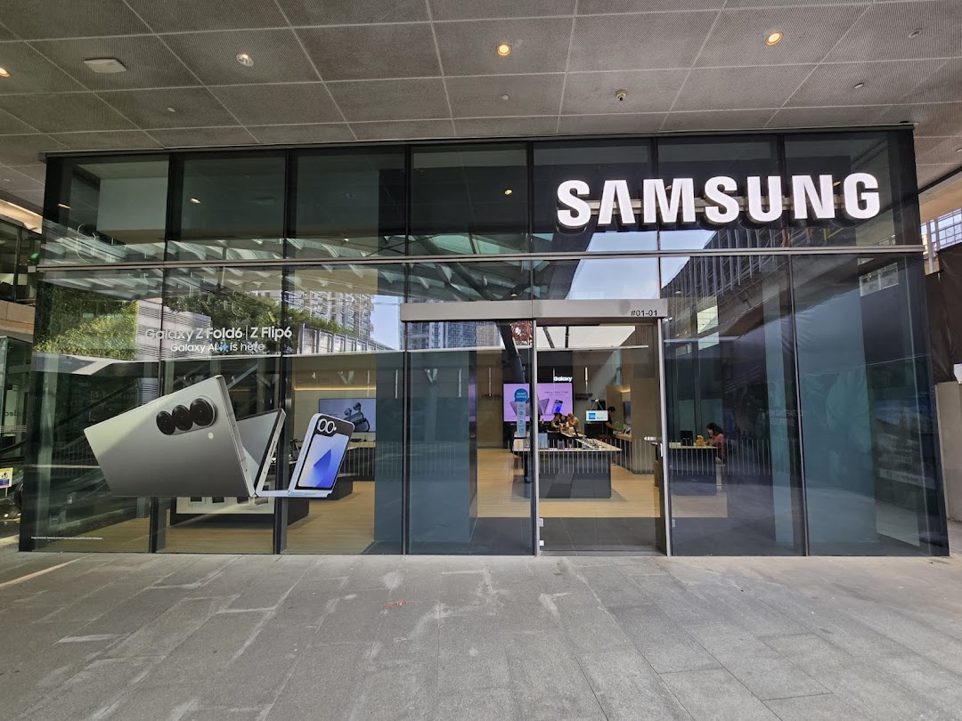 The glass facade of a Samsung Experience Store showcasing the latest Galaxy Z Fold6 and Z Flip6 models.