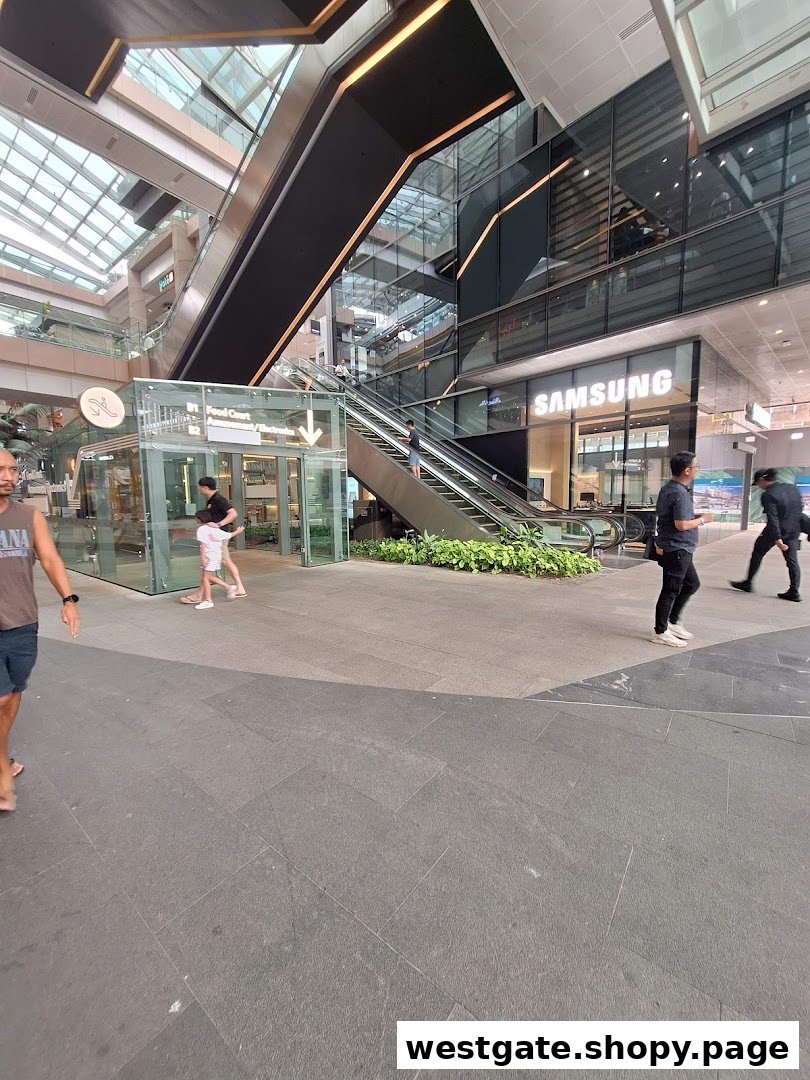 The Samsung Experience Store entrance is visible within a modern shopping mall, featuring escalators and glass architecture.