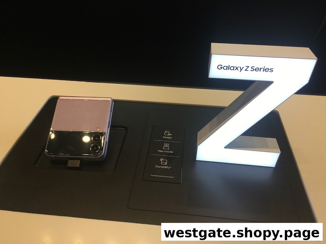 A Samsung Galaxy Z Flip phone displayed on a stand next to a lighted 'Galaxy Z Series' sign.