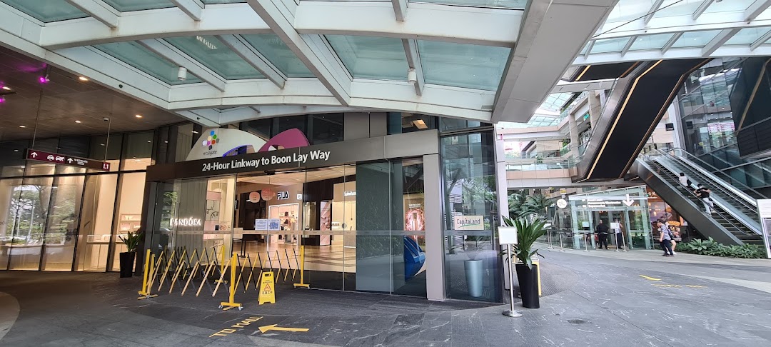 A modern Westgate Mall entrance with glass facade, leading to various shops and services.