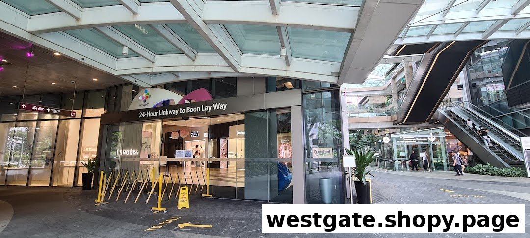 A modern Westgate Mall entrance with glass facade, leading to various shops and services.