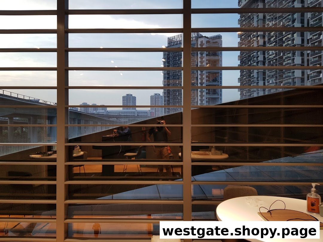 An interior view of the Samsung Service Centre, looking out through window blinds at a city skyline and reflections of the waiting area.