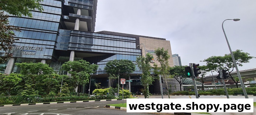 Exterior view of Westgate Tower and mall entrance from across the road on a cloudy day.