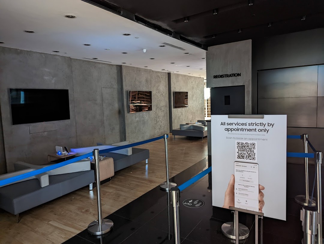 Interior of Samsung Service Centre Westgate, showing a waiting area and appointment sign.