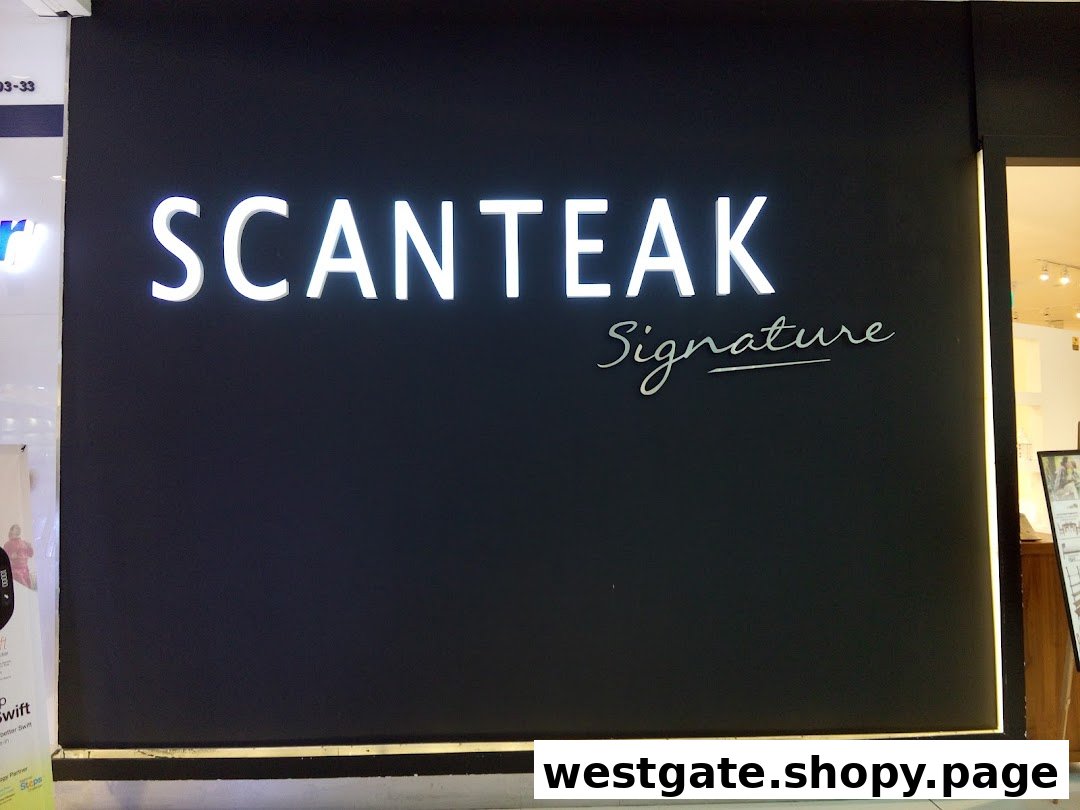 The image displays the sleek black facade of Scanteak Signature, featuring its illuminated white logo.