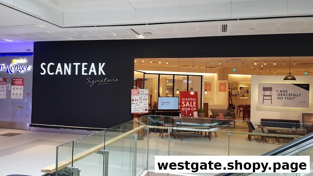 The shopfront of Scanteak Signature, a furniture store, showcasing its entrance and interior displays.