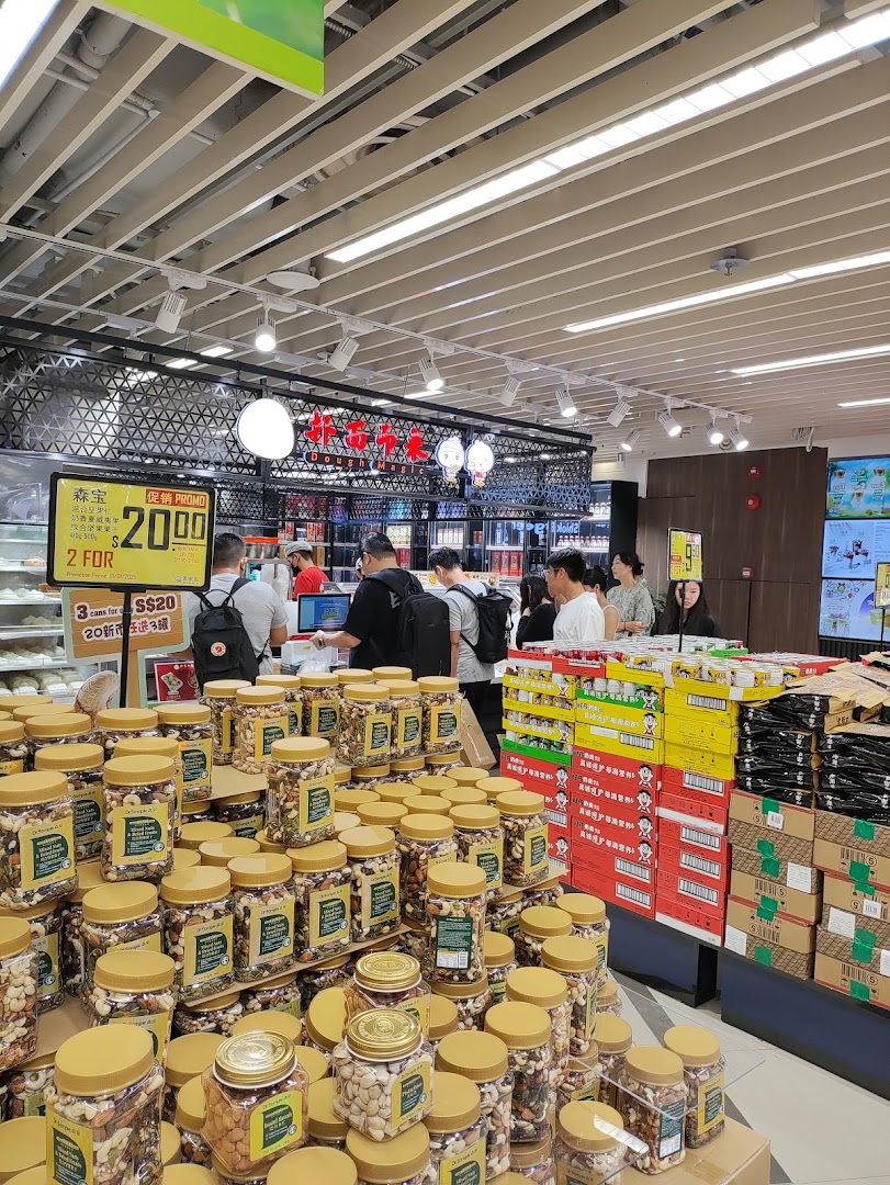 An interior view of Scarlett Supermarket, showcasing a large display of nuts and customers at the checkout.