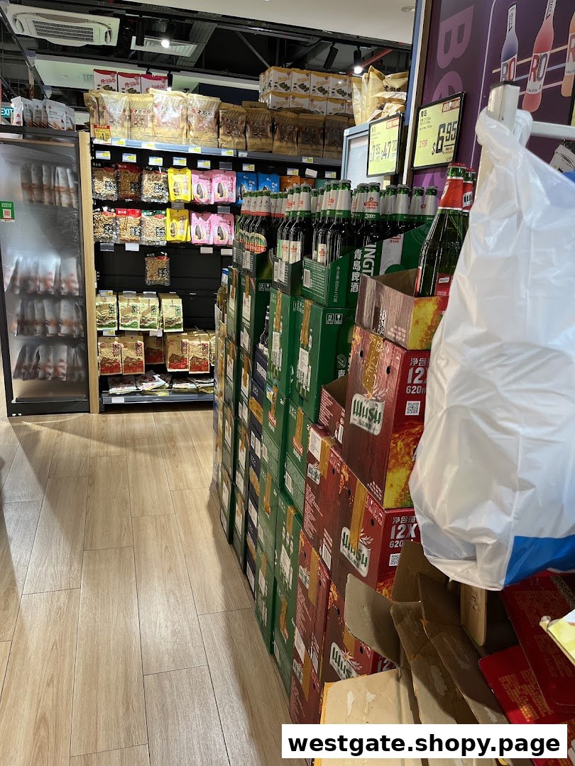 An aisle in Scarlett Supermarket featuring shelves of snacks and a large display of bottled beverages.