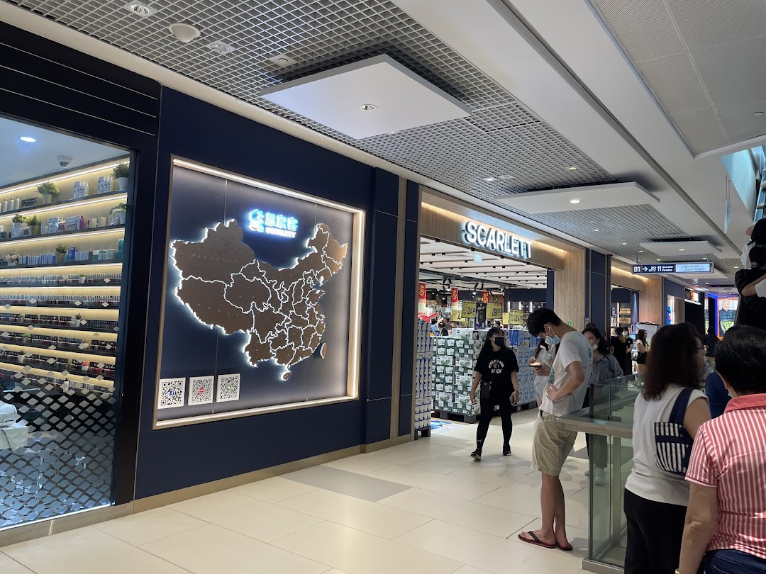 The storefront of Scarlett Supermarket at Westgate, featuring a map of China display and customers entering.