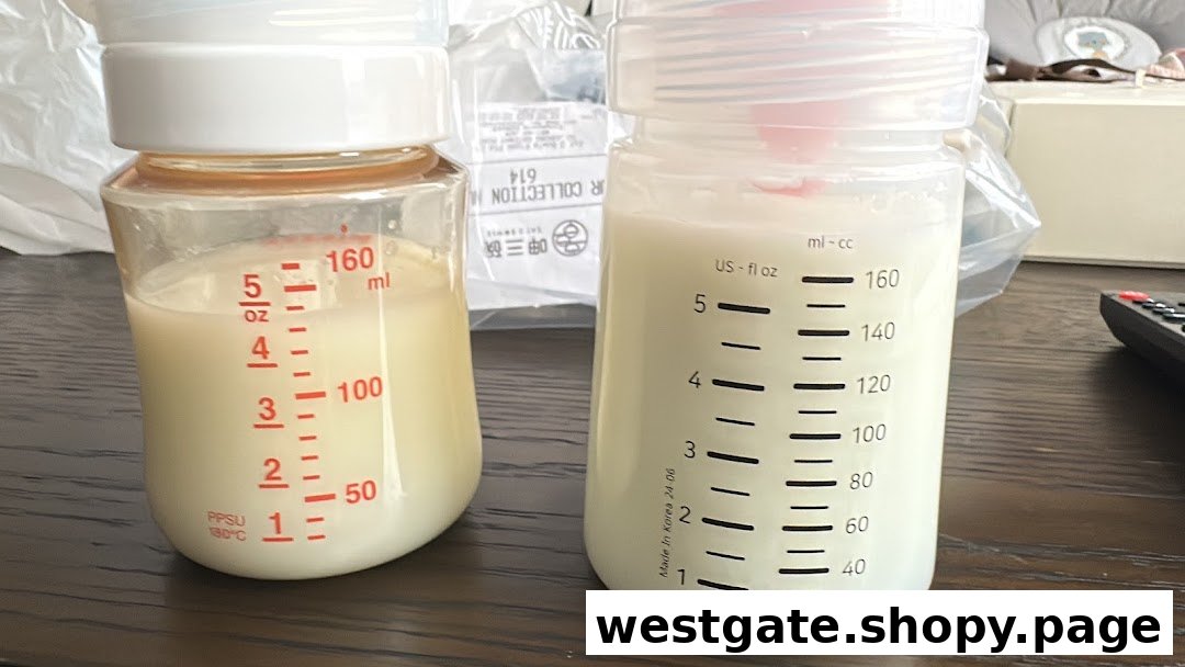 Two baby bottles, one with red markings and one with black, filled with milk on a wooden surface.
