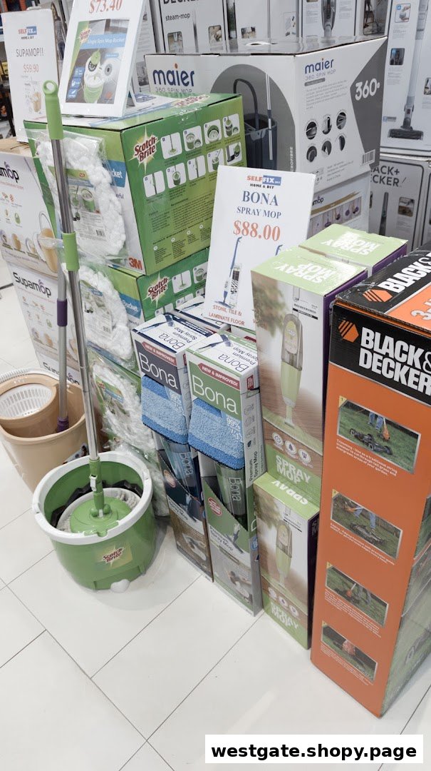 A retail display featuring various cleaning products like mops and spray mops, with prices visible.