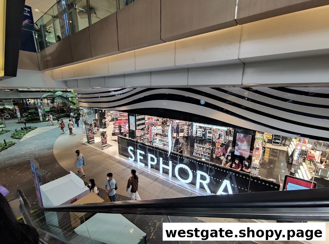 An elevated view of the Sephora store entrance, showcasing its prominent logo and vibrant interior.