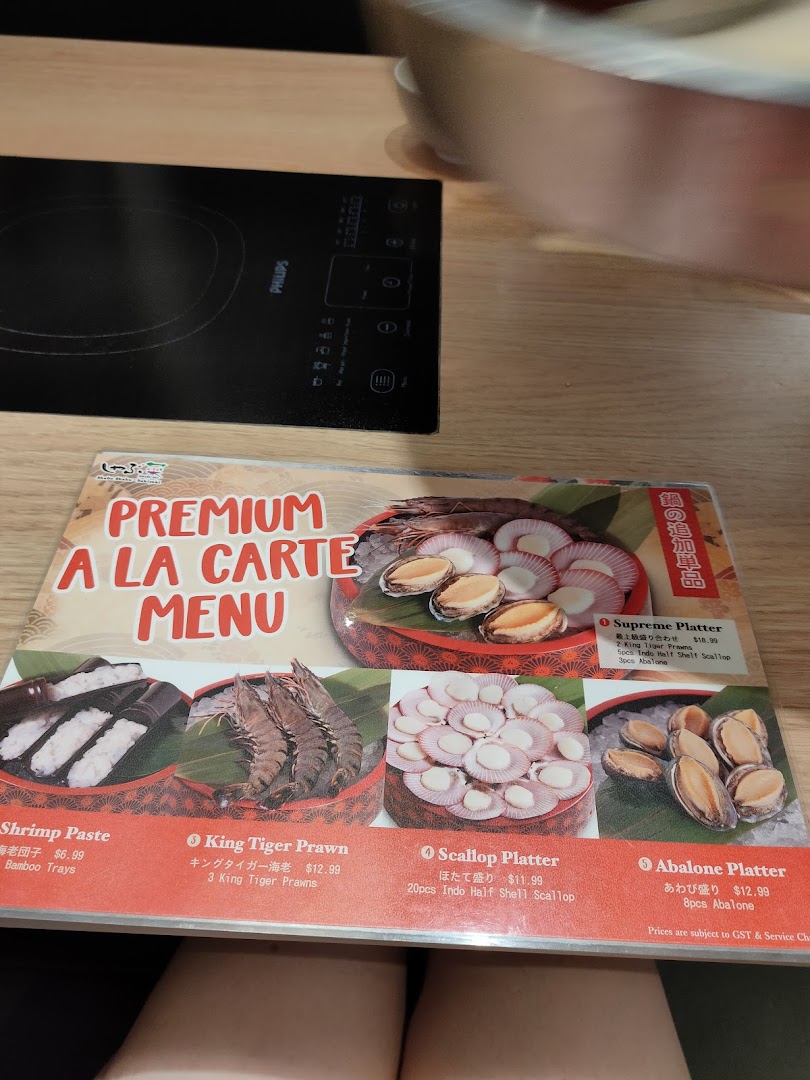 A close-up of Shabu Sai's Premium A La Carte Menu featuring various fresh seafood platters.