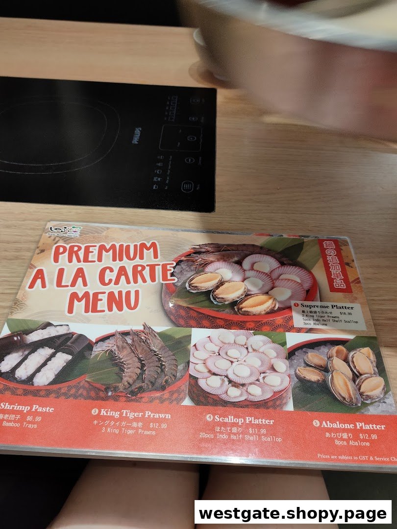 A close-up of Shabu Sai's Premium A La Carte Menu featuring various fresh seafood platters.