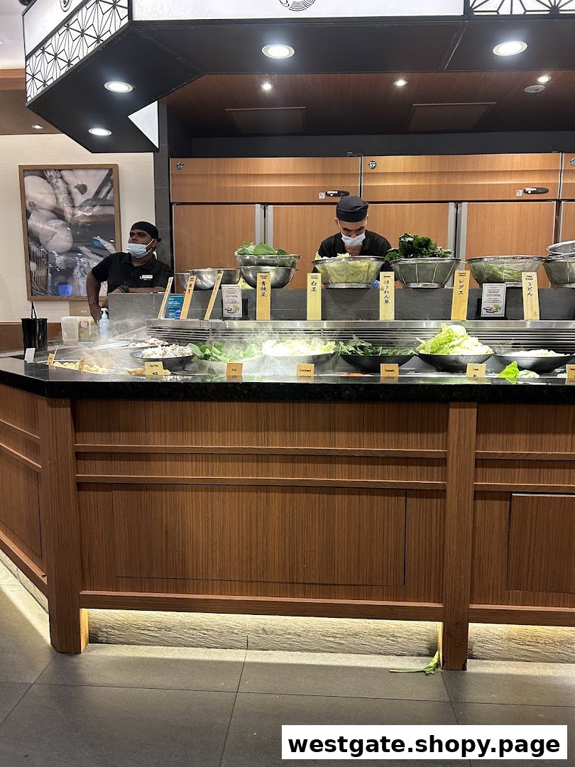 Staff prepare fresh ingredients at Shabu Sai's vibrant hot pot buffet counter.