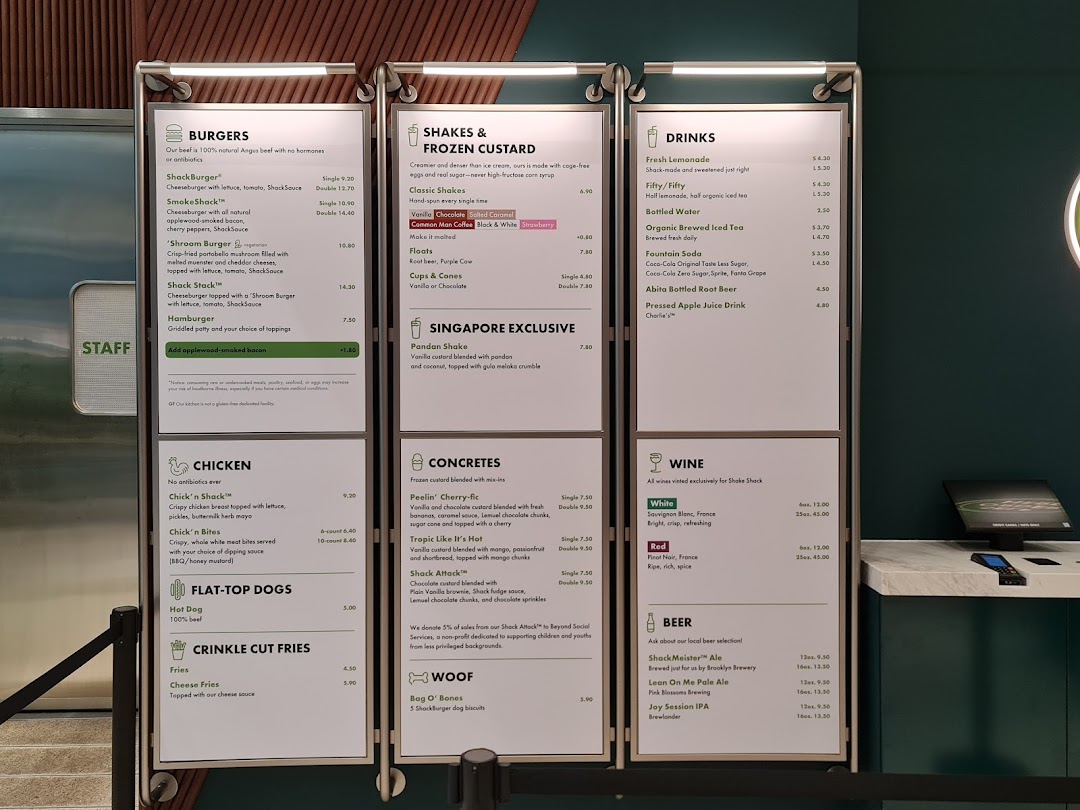A comprehensive view of Shake Shack's menu boards, showcasing burgers, shakes, drinks, and more.