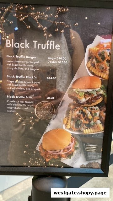 A menu board displaying Shake Shack's Black Truffle offerings with prices and images.