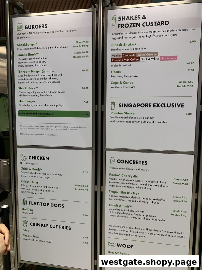 A detailed menu board displaying burgers, shakes, fries, and other items with prices.