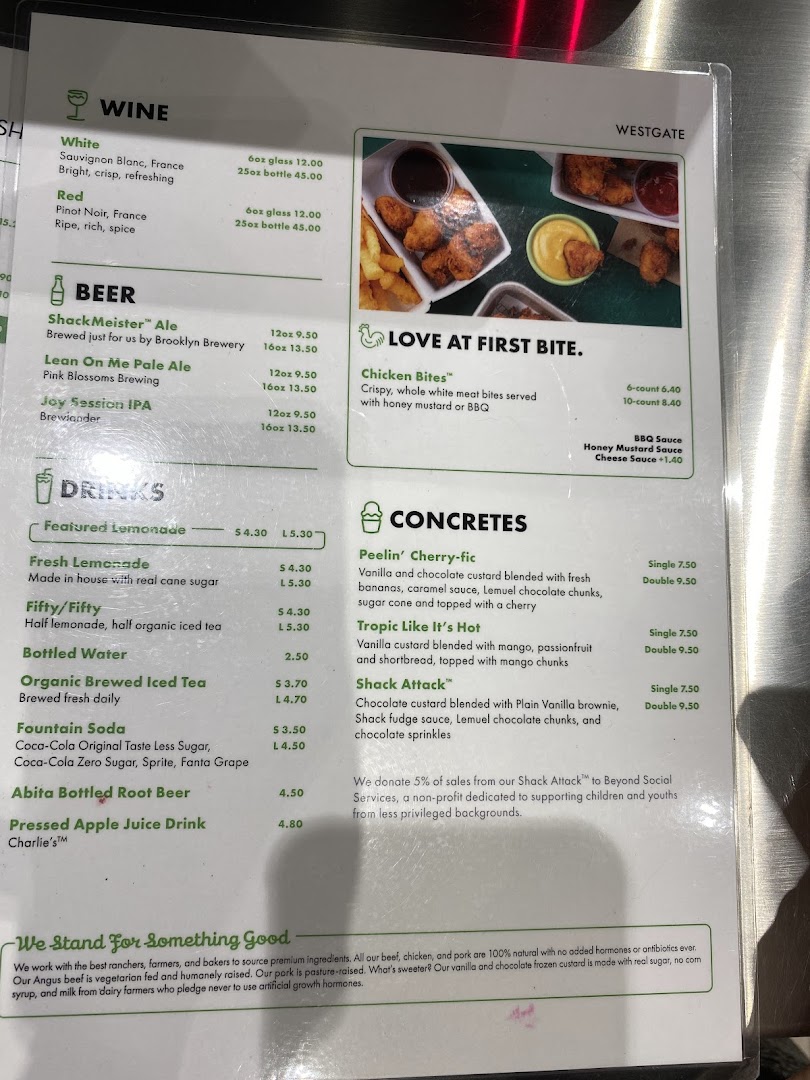 A detailed menu board from Shake Shack Westgate, showcasing food, drinks, and dessert options.