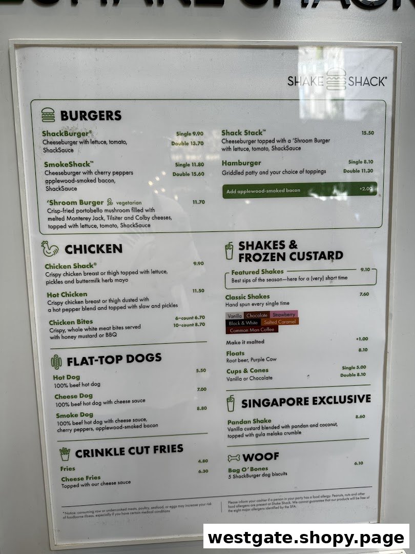 A detailed menu board for Shake Shack, displaying various burgers, chicken, hot dogs, fries, shakes, and desserts.