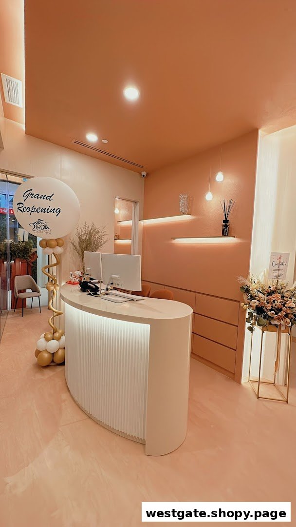 A modern, inviting reception area of a medical spa, featuring a white desk and 'Grand Reopening' decor.
