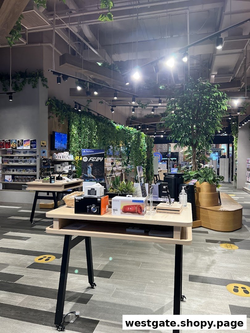 Interior view of a modern Sony Store featuring product displays, green decor, and spacious layout.