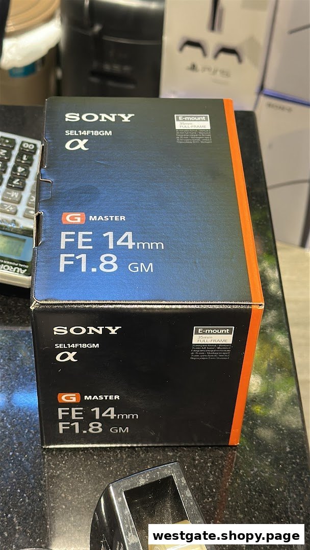 A Sony G Master FE 14mm F1.8 GM lens box displayed on a counter.