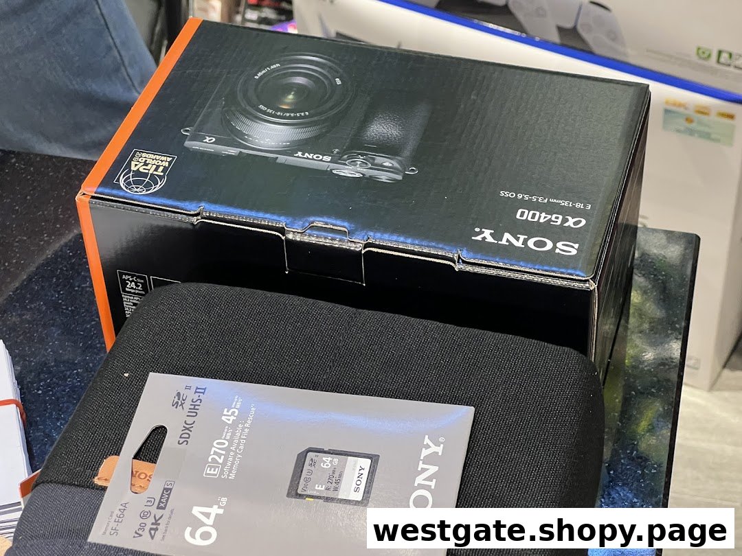 Close-up of a Sony a6400 camera box and a Sony SD card, showcasing electronics products.