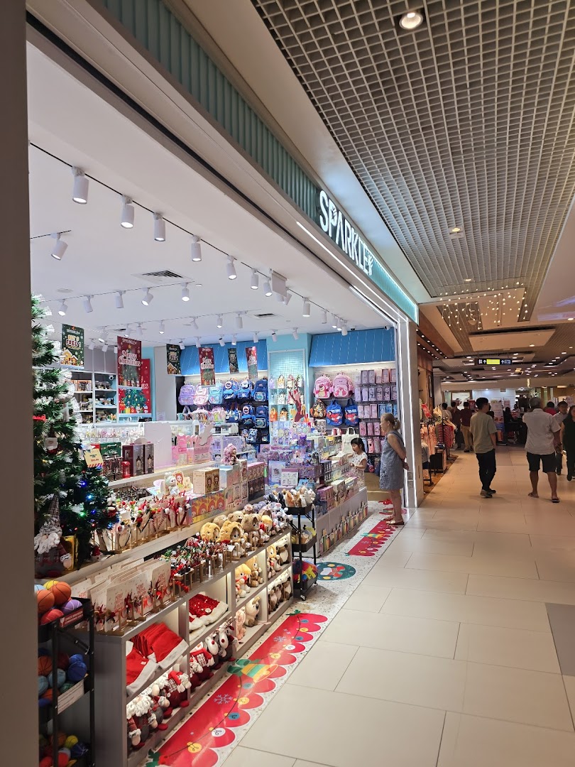 The Sparkle shop entrance, brightly lit and filled with gifts, toys, and festive decorations.
