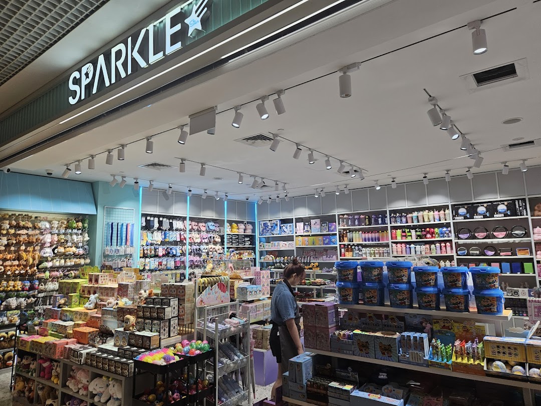 Interior view of SPARKLE shop, showcasing a wide array of novelty items, plush toys, and stationery.