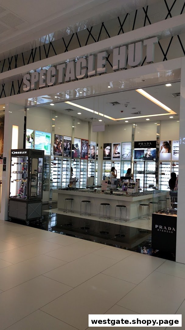The brightly lit entrance of Spectacle Hut, showcasing a wide range of eyewear and prominent brand displays.