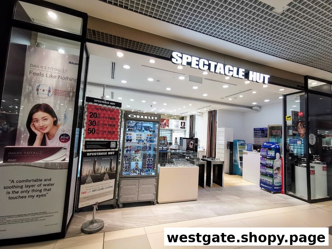 The entrance of Spectacle Hut, an eyewear store, featuring promotions and product displays.