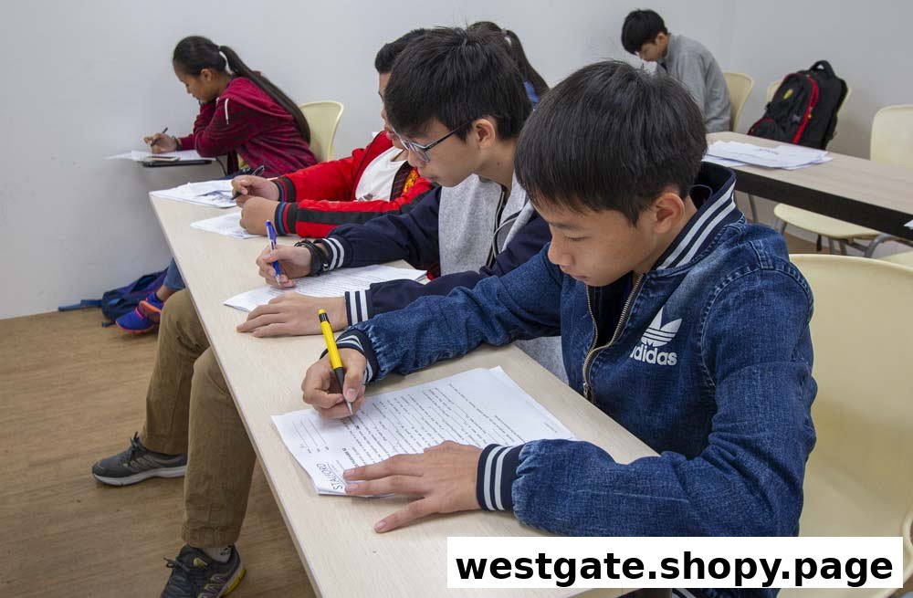 Students are diligently writing and studying in a classroom at Stalford Learning Centre.