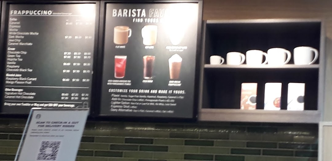 A Starbucks menu board displaying Frappuccino and Barista Favorites, with drink customization options.