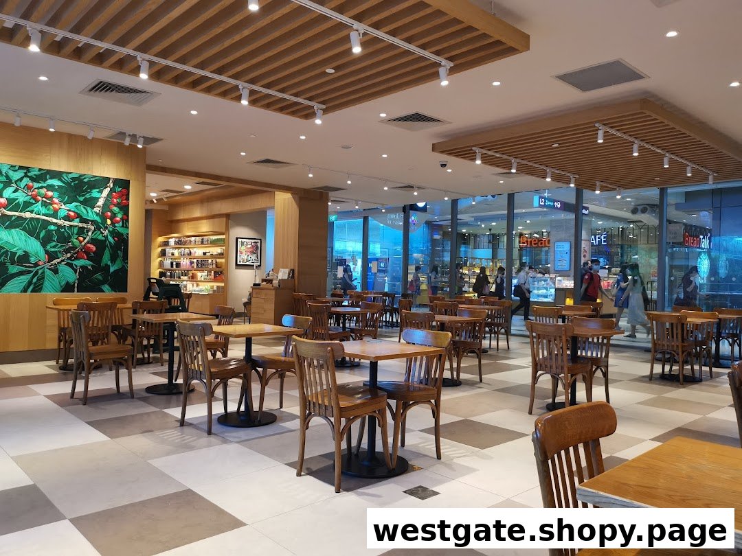 Spacious interior of Starbucks Westgate with wooden tables, chairs, and a large coffee plant mural.