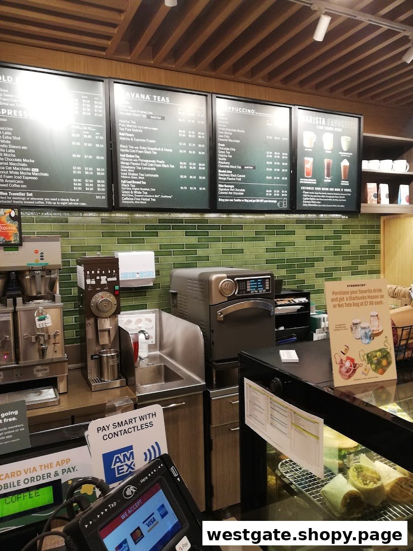 A view of the Starbucks counter area, featuring menu boards, coffee machines, and a display case.