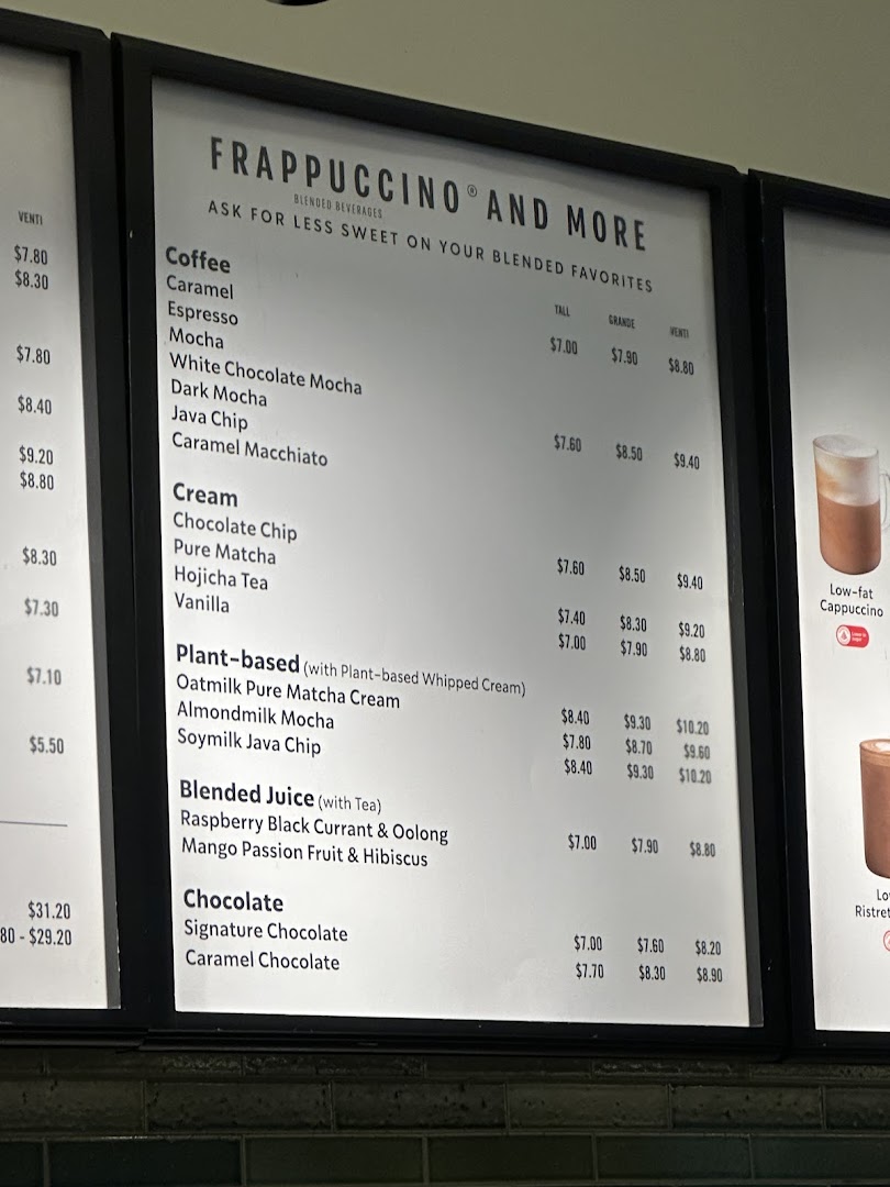 A detailed view of the Starbucks menu board, featuring Frappuccino and other blended beverages with prices.