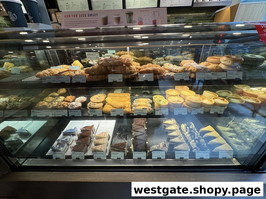 A vibrant display case showcasing a variety of fresh pastries, cakes, and savory bites at Starbucks.