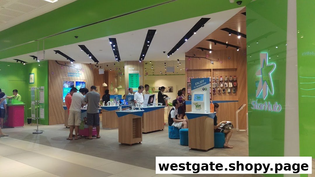 An interior view of the StarHub Westgate store, featuring customers browsing mobile devices and accessories.